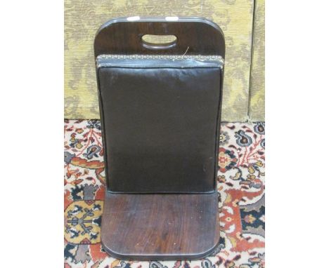 A good quality 19th century gout stool in rose wood, with cushioned panel within a brass stud border