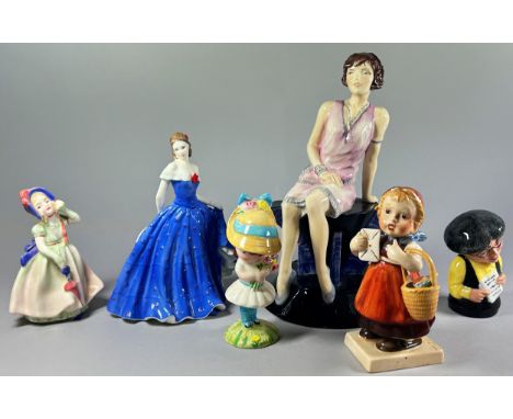 A collection of ceramics including Peggy Davies Ceramics trial piece of a seated female, four Lladro figure groups, a Nao gro