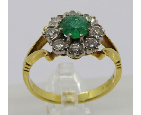 18ct emerald and diamond cluster ring with bifurcated shoulders, maker 'WB', London 1977, size N, 3.7g