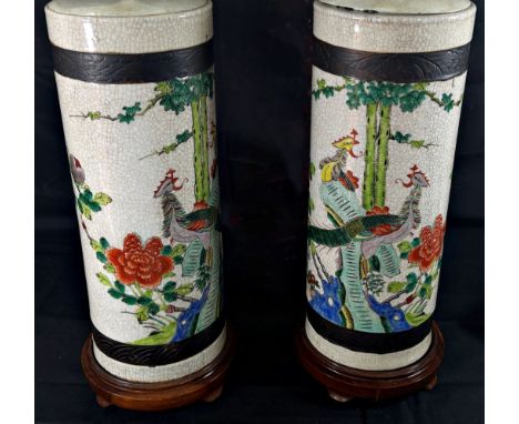 A pair of Chinese crackle glaze sleeve vases, decorated with exotic birds in floral settings, later converted as twin-light l