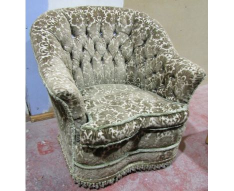 A mid 20th century button back tub chair with upholstered finish 