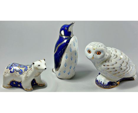 Three Royal Crown Derby figures to include Platinum Penguin, Snowy Owl and Polar Bear Cub all with gold buttons (3)