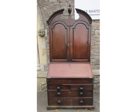 An 18th century mahogany and oak lined bureau bookcase, the lower section enclosed by two long and two short drawer, the fall