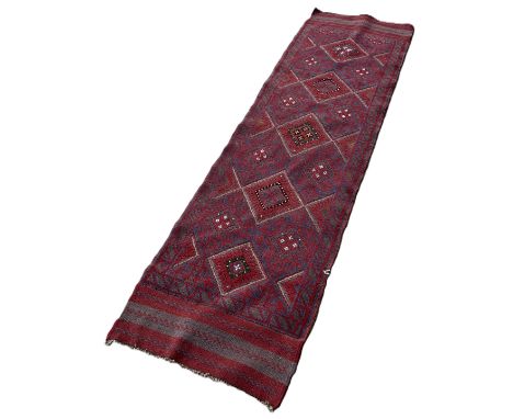 A Meshwani runner with a red and blue diamond pattern 247cm x 67cm 