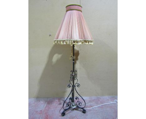 A scrolling ironwork standard lamp. 