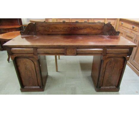 A William IV mahogany pedestal sideboard enclosing cupboards and cushion moulded drawers with well matched veneers 