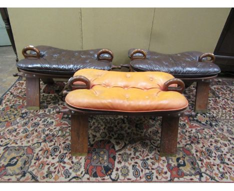 Three traditional Camel stools in hardwood with brass inlaid detail and cushion mounts, 35cm high x 75cm long x 35cm wide app