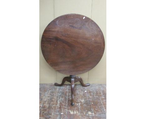 A Georgian mahogany snap top table, the large single piece top 83cm diameter, raised on a birdcage, vase-shaped column and tr