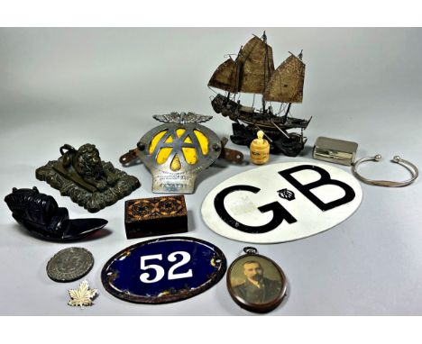 Box of bijouterie items to include a Regency period brass lion, Chinese metal junk, vintage AA badge, etc