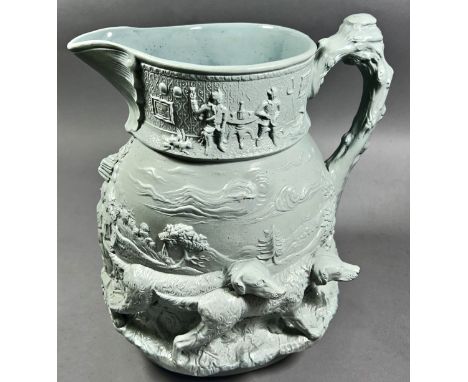 A Masons relief moulded jug showing hounds in landscape, to the upper rim an interior merrymaking scene at the end of a day's