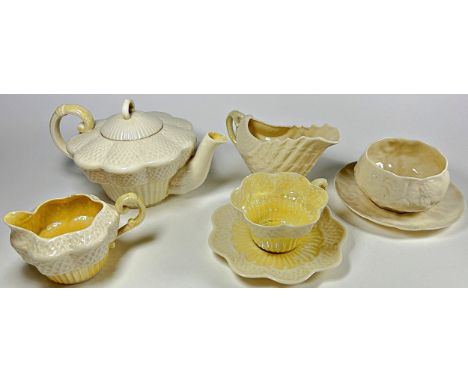 A Belleek Erne part tea set comprising teapot, milk jug, cup and saucer with black device marks to undersides, a further suga