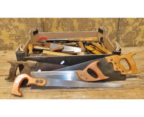 A box of vintage woodworking tools to include a selection of saws, chisels, etc