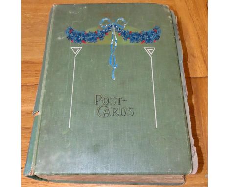 An Edwardian album of photographs, picture postcards (actresses of the era), greetings cards, theatrical / fashion stills etc