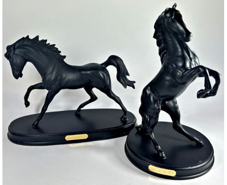 Four matt glazed ceramic figures by Royal Doulton of horses in various poses, two in black and two in white 'The Spirit of Fr