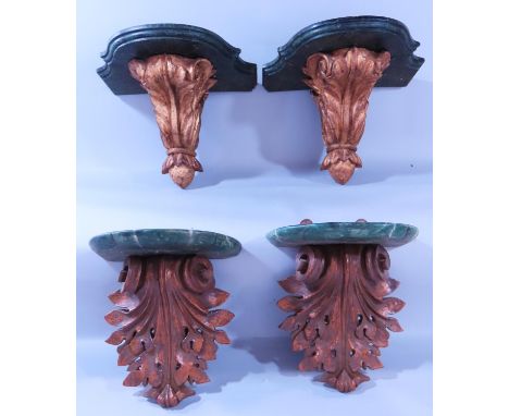 A pair of gold finished acanthus leaf wall brackets with feather painted malachite shelf, 27cm wide and another pair similar,