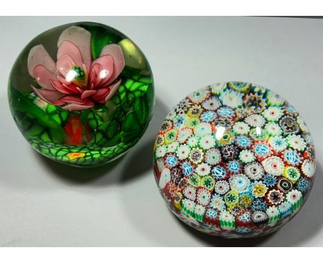 A Baccarat style millefiori cane paperweight, together with a Baccarat style flower with pink petals paperweight and four gre