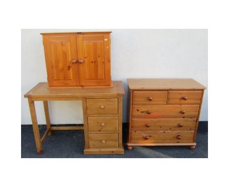 A contemporary pine chest of three long and two short, single pedestal desk and a pine cupboard with two doors (3)