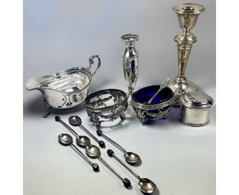 A mixed selection of silver ware to include a Georgian style gravy boat, a candlestick, a small posy vase, a mustard pot, six