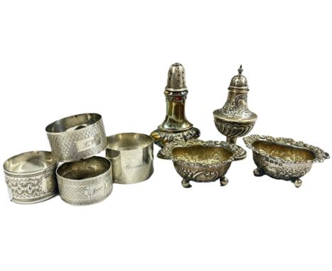 A pair of silver salt cauldrons, two pepper pots and four silver napkin rings 7.3 0z, together with six boxes of plated cutle