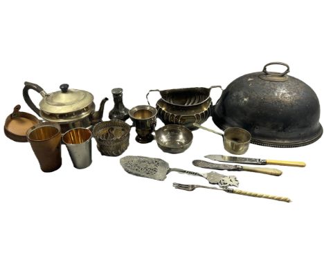 A miscellaneous collection of silver plated ware including tureens, meat domes, loose cutlery, trophies, three stirrup cups i