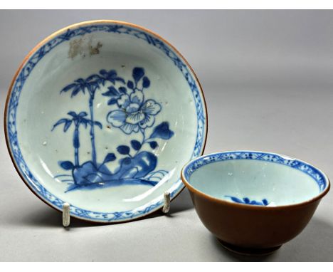 A Nanking Cargo shipwreck cafe au lait tea bowl and saucer with underglaze blue interior decorations to both pieces, both bea