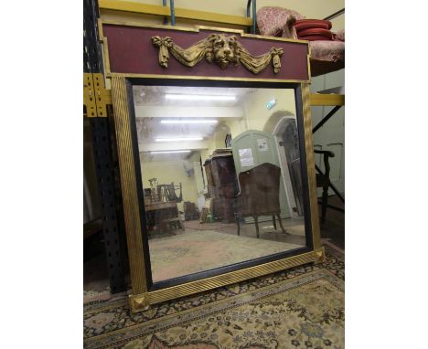 A Regency style mirror, the mirror plate set beneath a lion mask swag frieze, 160 x 138cm