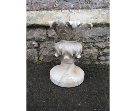 A carved alabaster two sectional part column/tazza with acanthus detail, 34 cm high