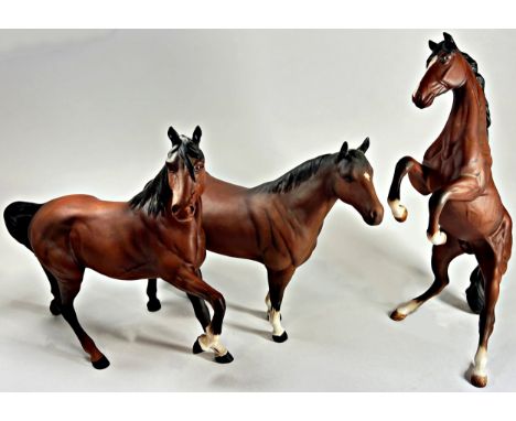 A collection of seven Beswick ceramic horses and foals in various poses in a matt glaze finish, together with a further Royal