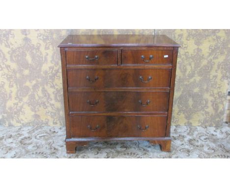 A Georgian style mahogany bedroom chest of three long and two short graduated drawers set on bracket feet, 83 cm high x 81 cm