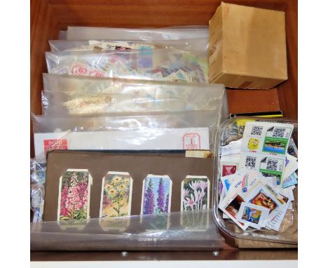 A collection of stamps and cigarette cards, including one album of early to mid 20th century international stamps