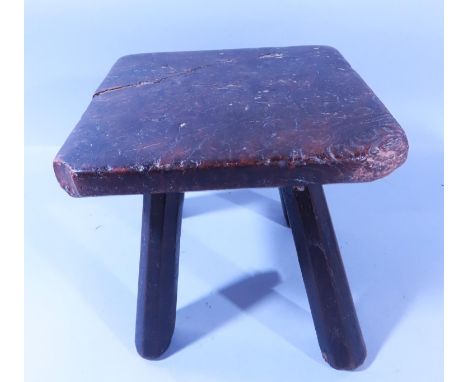 An old rustic four legged low stool, 17cm high.