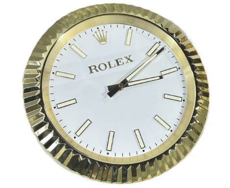 A contemporary decorative ‘Rolex dealer display’ wall clock, marked ‘Rolex’ to the white 10” dial, gilt ‘bezel’ case.