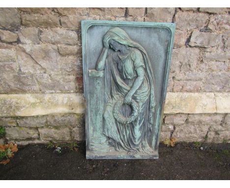 A verdigris weathered cast bronze architectural panel with raised relief detail of a classical maiden clutching a laurel wrea