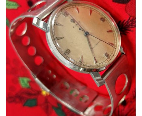 Rolex: A gentleman’s vintage stainless steel wristwatch, with Arabic numerals and baton spacers, 33mm case, on associated Swi