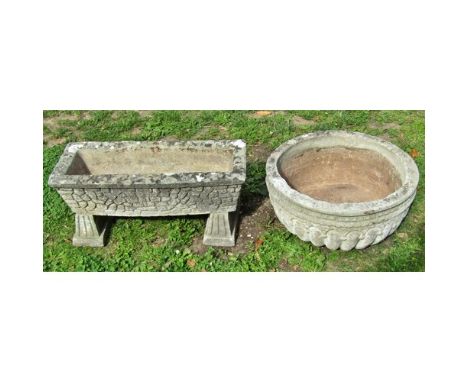 A weathered cast composition stone squat circular planter with lobbed bowl 25 cm high x 55 cm diameter together with a furthe