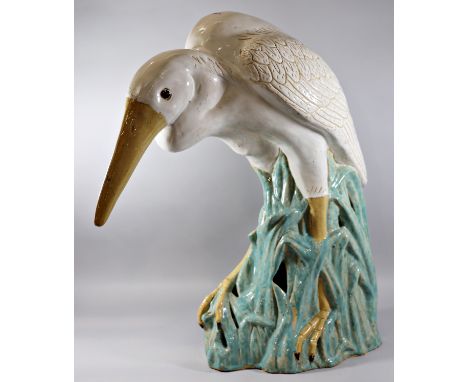 A contemporary Chinese model of a Heron fishing, 70cm high