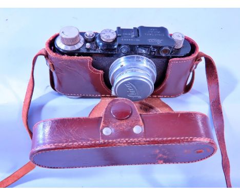 Photography Interest - A Leica camera, model standard II, number 106063 - 1933, together with a leather case