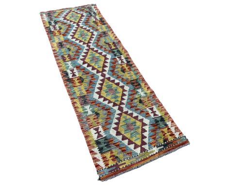 A Chobi kilim runner with a central row of stepped diamond, 198cm x 66cm