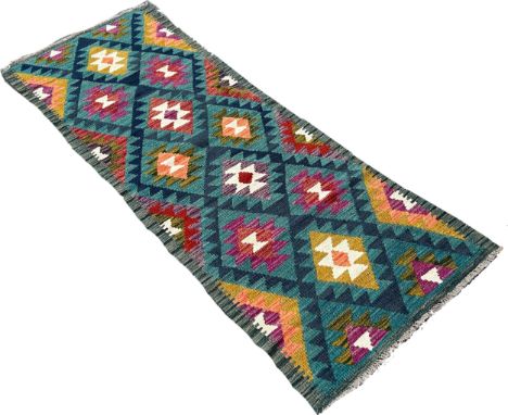 A Maimana Kilim runner, with rows of stepped medallions, 192cm x 70cm approximately