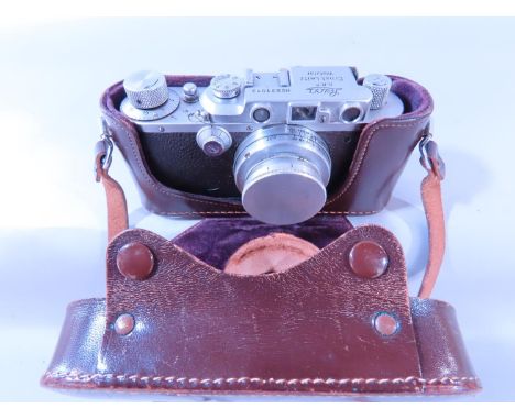 Photography Interest - A Leica camera no 231013, 1936, together with its Leica camera case