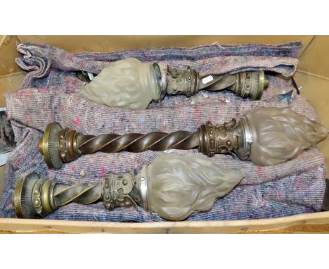 A trio of reclaimed cast bronze gothic flaming torch light fittings with moulded glass shades 