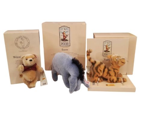 Three boxed Steiff toys comprising Winnie the Pooh, Eeyore and Tigger, with tags