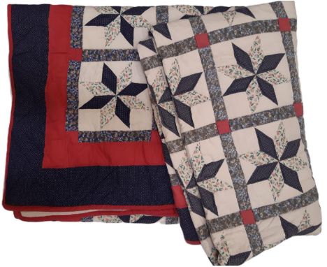 A modern patchwork quilt in a traditional design of printed cottons, hand quilted with running stitch, 2.8x 2.8m (kingsize)