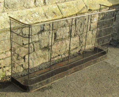 A 19th century wirework fireguard with brass rail, 61 cm high x 121 cm