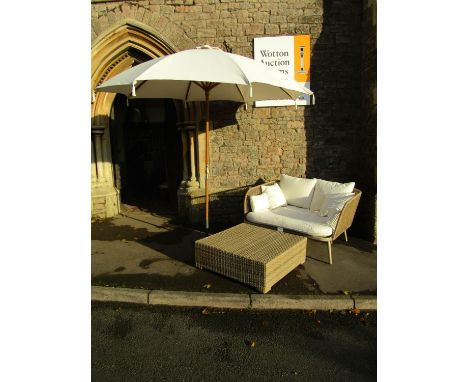 A contemporary painted light steel framed garden/conservatory sofa with bound framework and loose cushions, together with a l