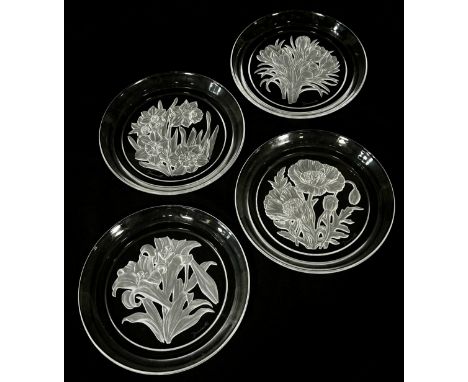 Twelve Japanese Hoya Crystal Art Glass plates engraved with a flower for each month of the year, all signed T. Yamamoto.