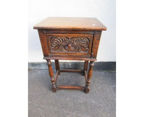 An old English oak style joint or coffin stool, and a smaller example, an oak cabinet with carved door, a circular Victorian 