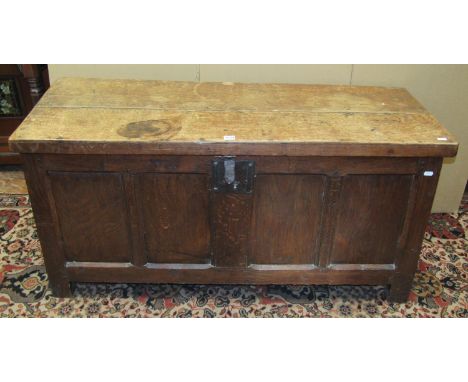 An antique oak coffer with panelled framework and steel lock plate, 61cm high x 125cm x 52cm