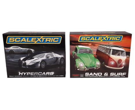 Two box sets of Scalextric cars including Sand and Surf and Hypercars. Unused and securely presented. 