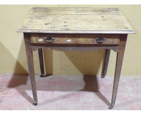 A Georgian oak countrymade side table with frieze drawer on  square tapered legs, 74cm high x 79cm wide x 49cm deep